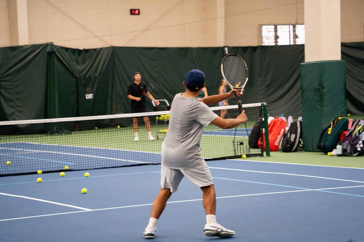 MVP Athletic Clubs, Boy playing tennis on an indoor court