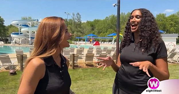 Host interview in front of outdoor pool.