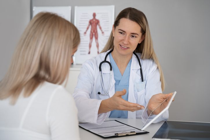 Female doctor reviewing information with patient.